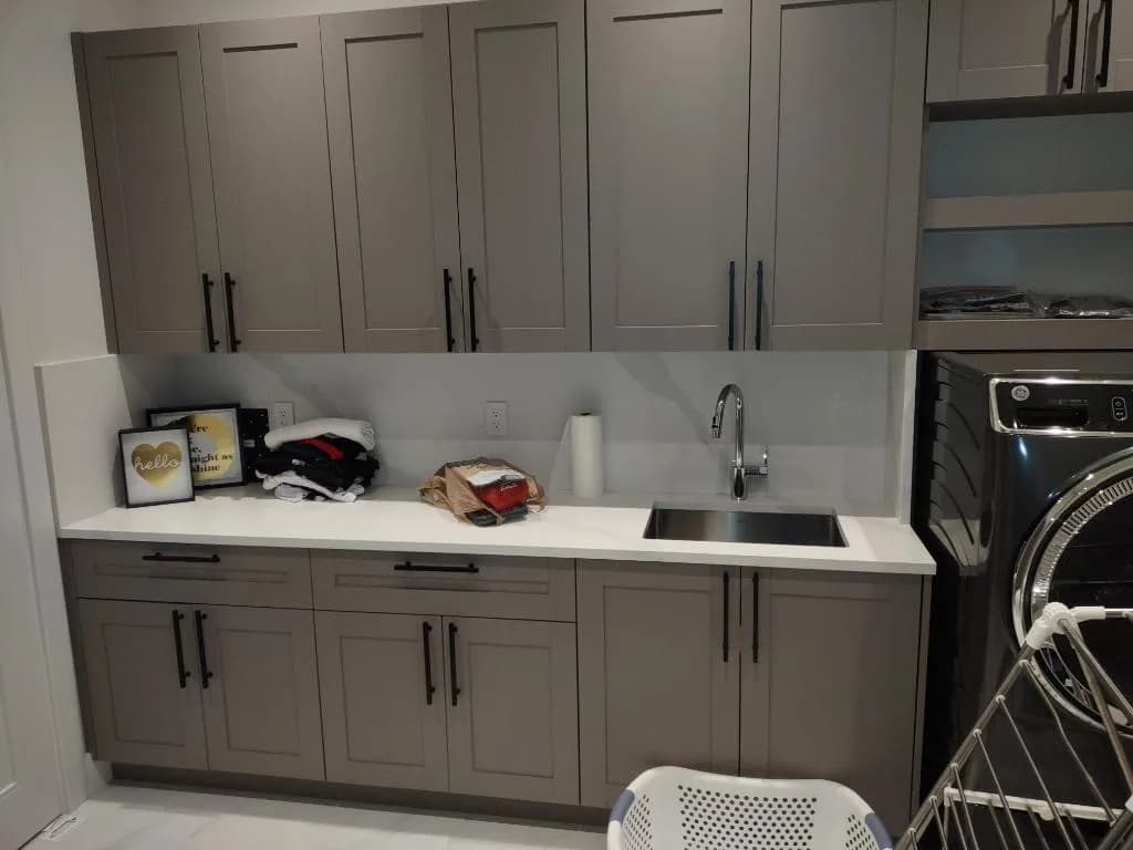 Artisan finishing a custom cabinet at Morantz Custom Cabinetry